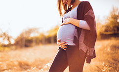 pregnant woman in field