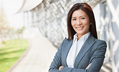 woman in suit standing outside office building