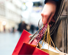 hand holding shopping bags