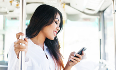 woman on public transportation holding phone