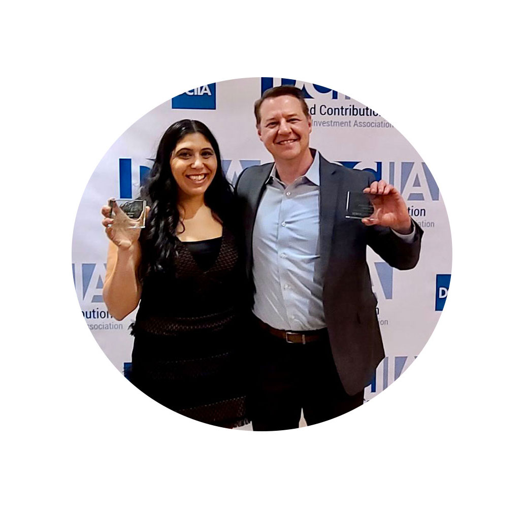 Male and female Empower associates hold DCIAA awards