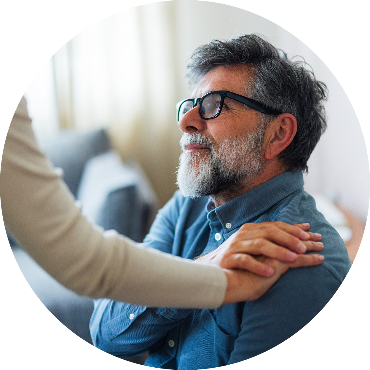 Person offering comfort and support to someone following the loss of a loved one.