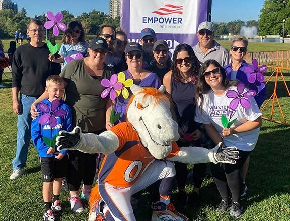 Empower associates pose with Denver Broncos mascot at Walk to end Alzheimer's event