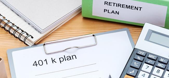 Retirement plan documents sit on a desk