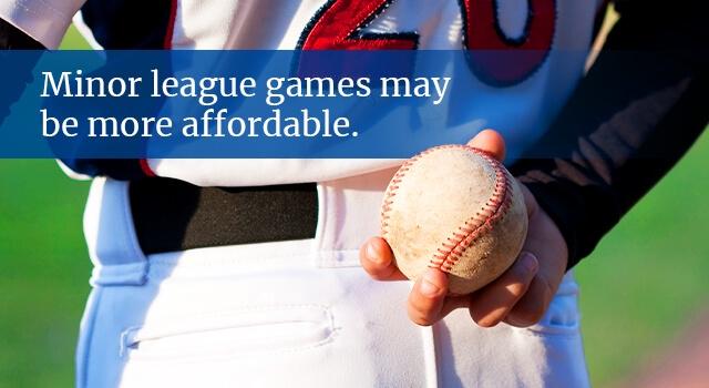 Pitcher holds baseball behind back. Text: Minor league games may be more affordable.