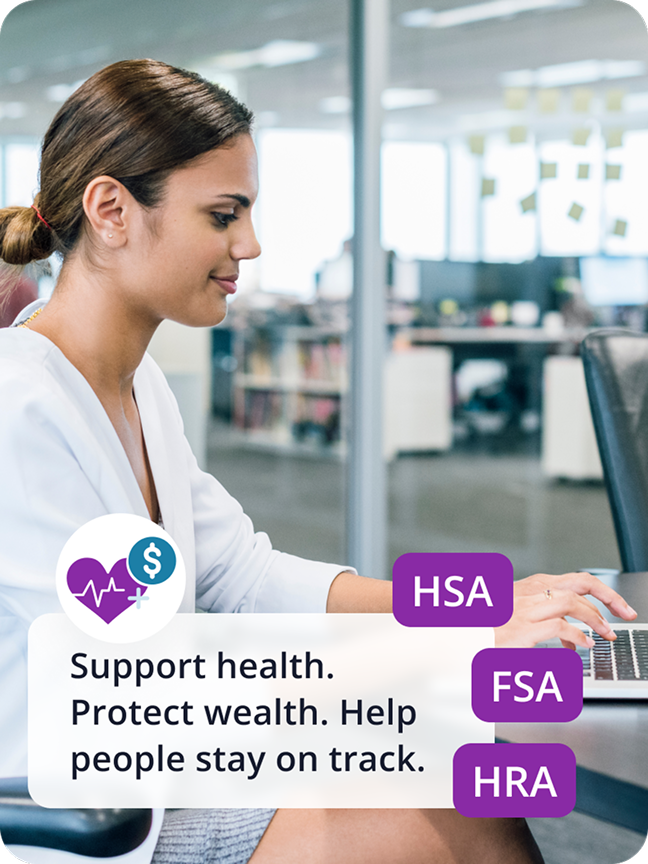 A woman sits at a desk, typing on laptop. Support health. Protect wealth. Help people stay on track. 