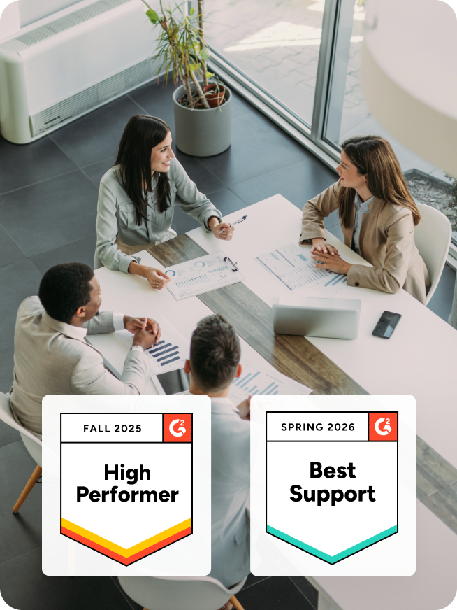 Company employees sit at a conference table in discussion. Graphics: Fall 2025 High Performer. Spring 2025 Best Support.