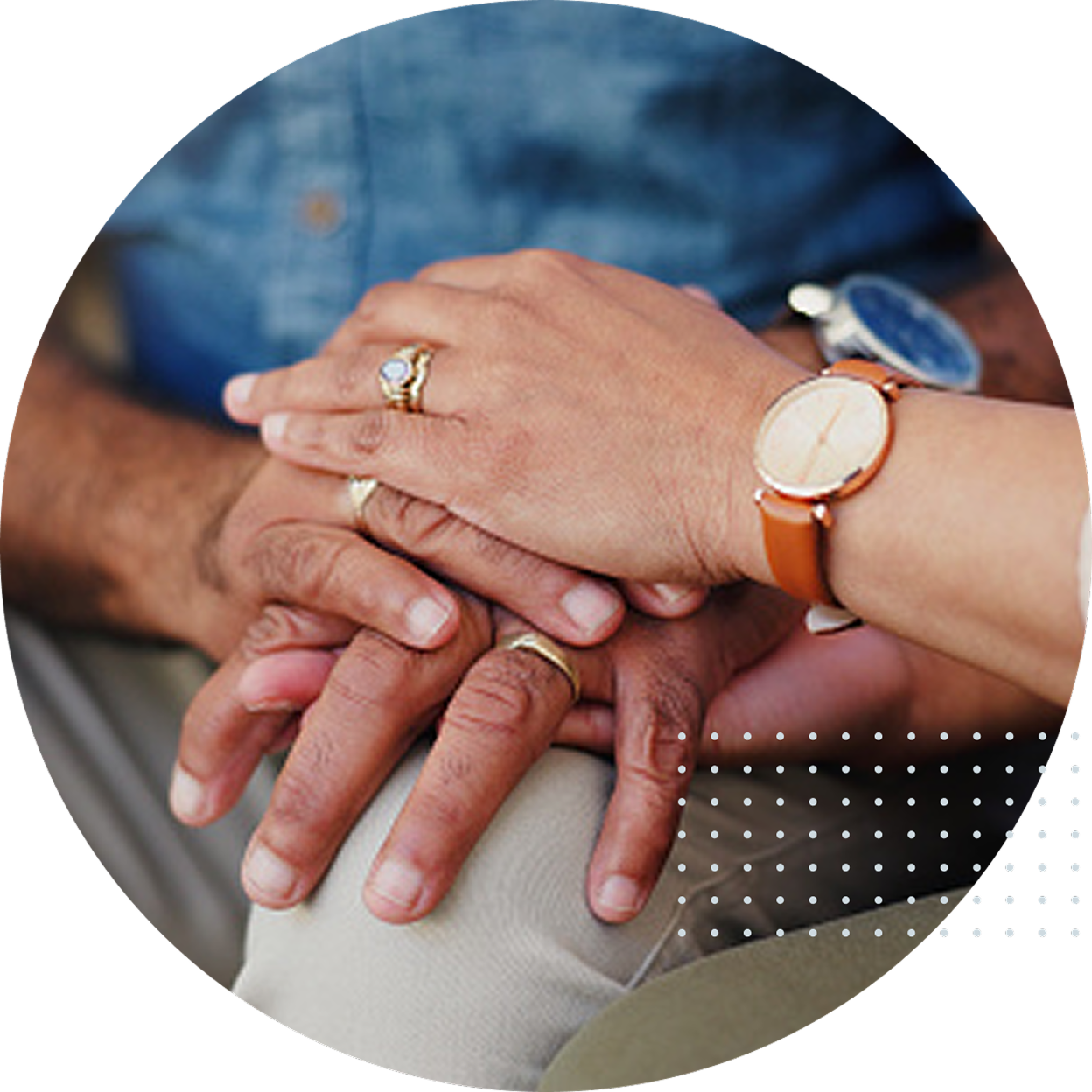 Two people holding hands, representing support and guidance for beneficiaries after the loss of a loved one.