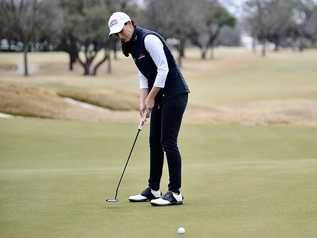 Cheyenne Knight, LPGA golfer, lines up a putt