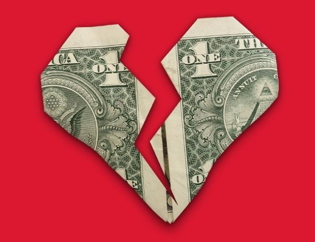 Image of dollar bill heart broken in half on red background
