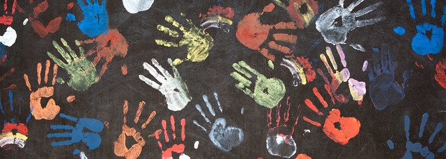 multi-colored hand prints on canvas
