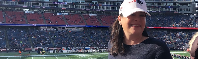 Empower Retirement associate Stacey Cappella poses at Patriots football game at Gillette stadium