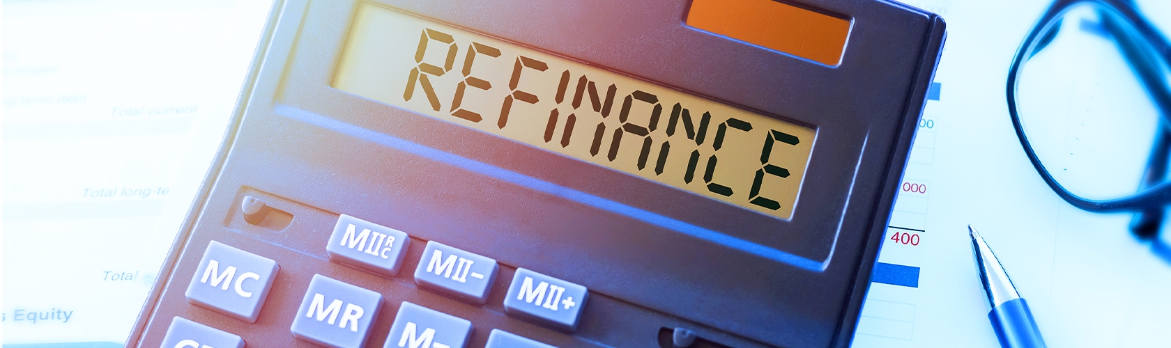 Close up view of calculator with word REFINANCE on screen